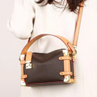 Make a statement with this luxurious and elegant box bag for women. Crafted from high-quality leather, this shoulder handbag features an elegant top-handle design, exuding sophistication and style for a classy finishing touch to your ensemble. -
