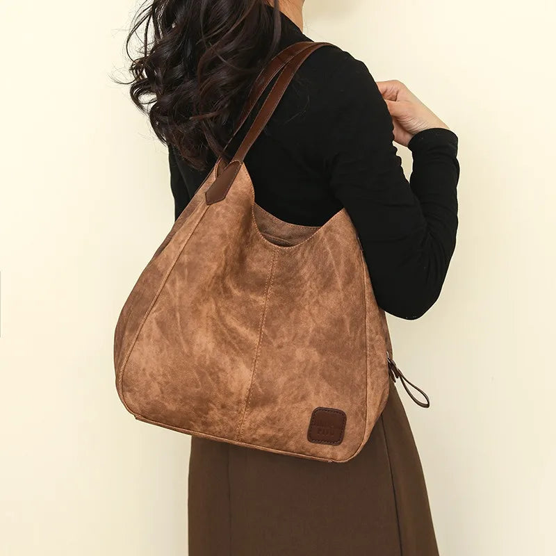 Stay organized and stylish with this large work tote bag for women. Designed with designer PU leather, this big bucket bag is perfect for carrying all your essentials in a chic and fashionable way. -