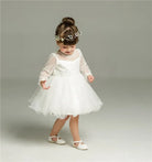 Make your baby girl shine in this elegant long-sleeve white party dress—perfect for special occasions! -