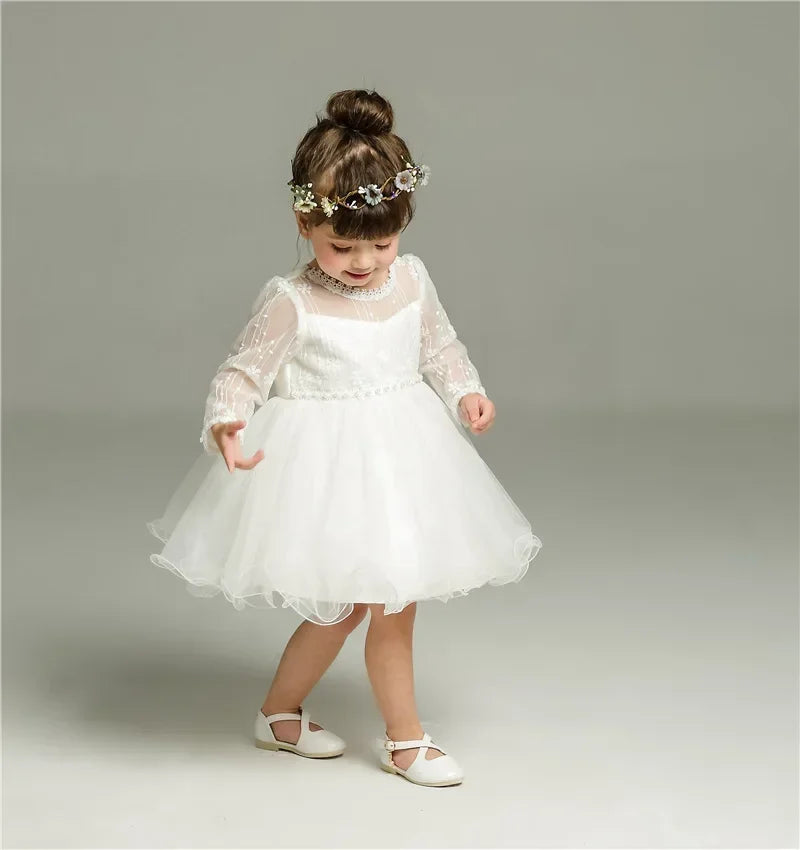 Make your baby girl shine in this elegant long-sleeve white party dress—perfect for special occasions! -