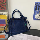 Elevate your casual look with this denim shoulder bag for women. Featuring a large design and zipper closure, this bag is perfect for shopping and everyday use, adding a touch of style to your outfit. -