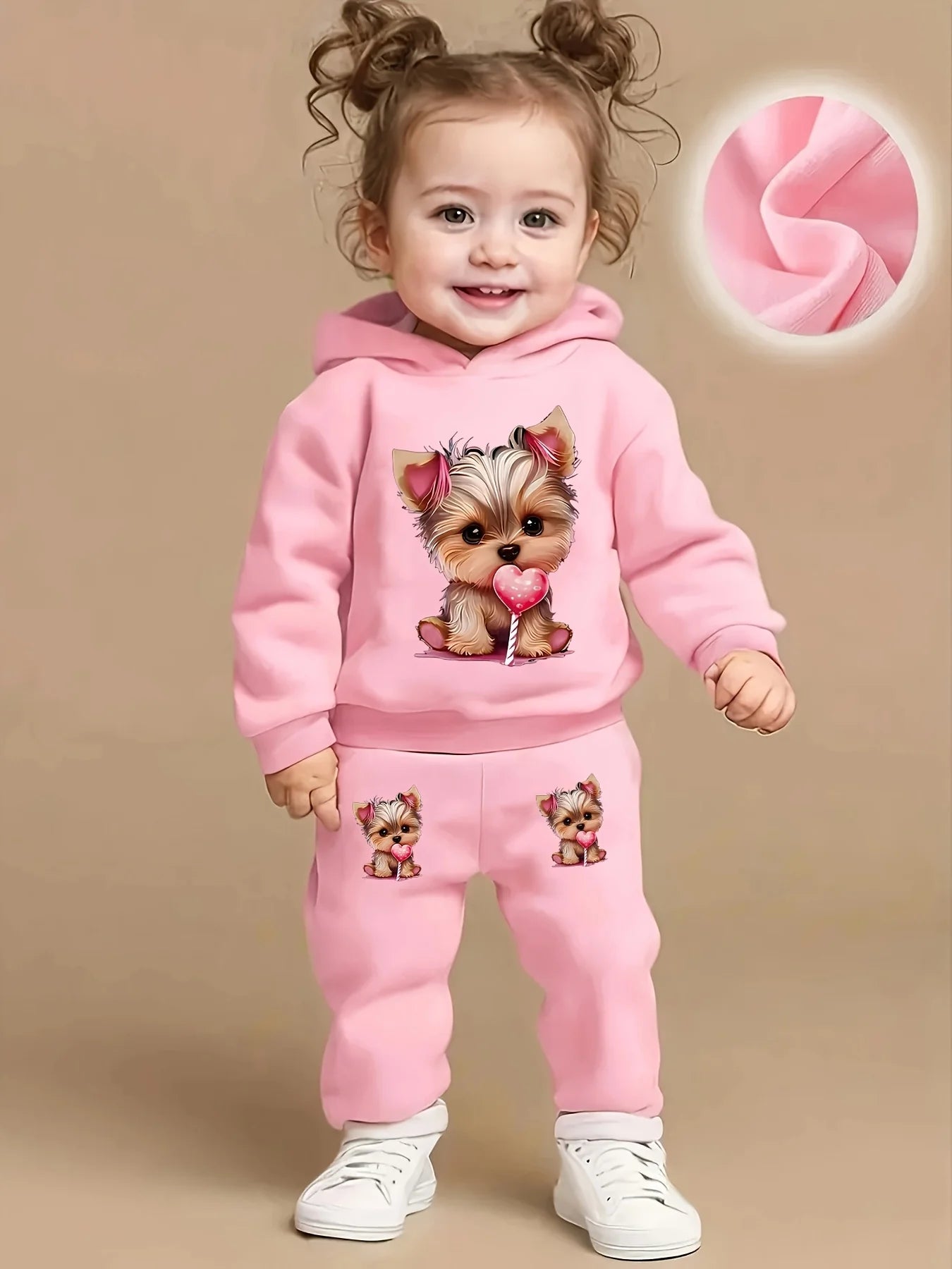 Keep your baby girl cozy and adorable with this fleece hoodie and pants set featuring a cute dog pattern print! -