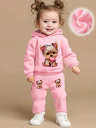 Keep your baby girl cozy and adorable with this fleece hoodie and pants set featuring a cute dog pattern print! -