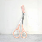 Eyebrow trimming scissors with built-in comb -