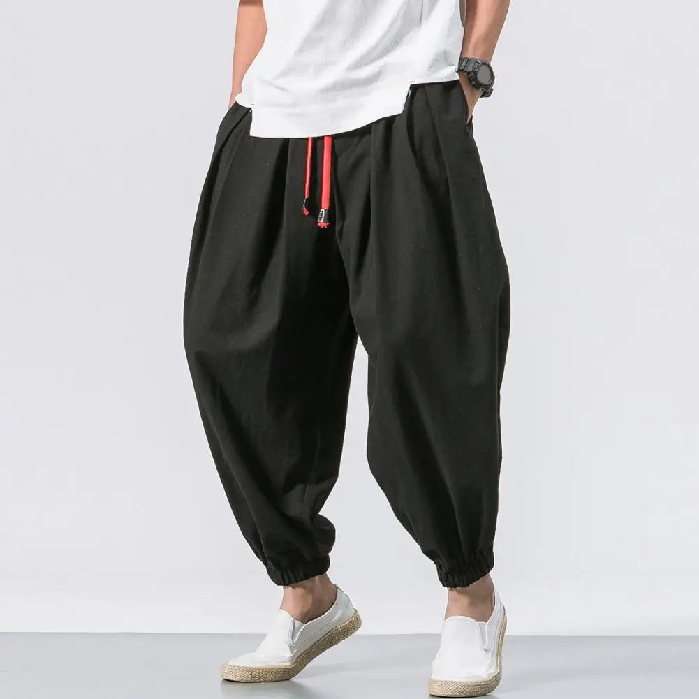 Stay comfortable and stylish in these men's baggy jogging pants featuring a drawstring waist—an ideal choice for a relaxed and casual look! -