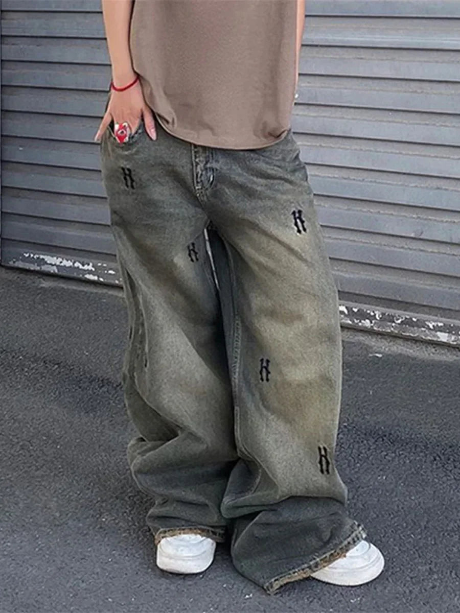Rock the retro vibe with these baggy distressed low-rise vintage denim pants—loose, patched, and perfect for a cool mom style! -