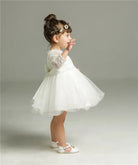 Make your baby girl shine in this elegant long-sleeve white party dress—perfect for special occasions! -