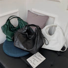 Make a stylish statement with these large shoulder bags designed for women. Crafted from soft leather, these fashionable handbags are perfect for adding a touch of sophistication to any outfit. -