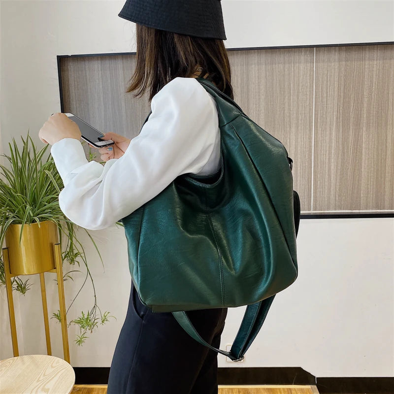 Make a stylish statement with these large shoulder bags designed for women. Crafted from soft leather, these fashionable handbags are perfect for adding a touch of sophistication to any outfit. -