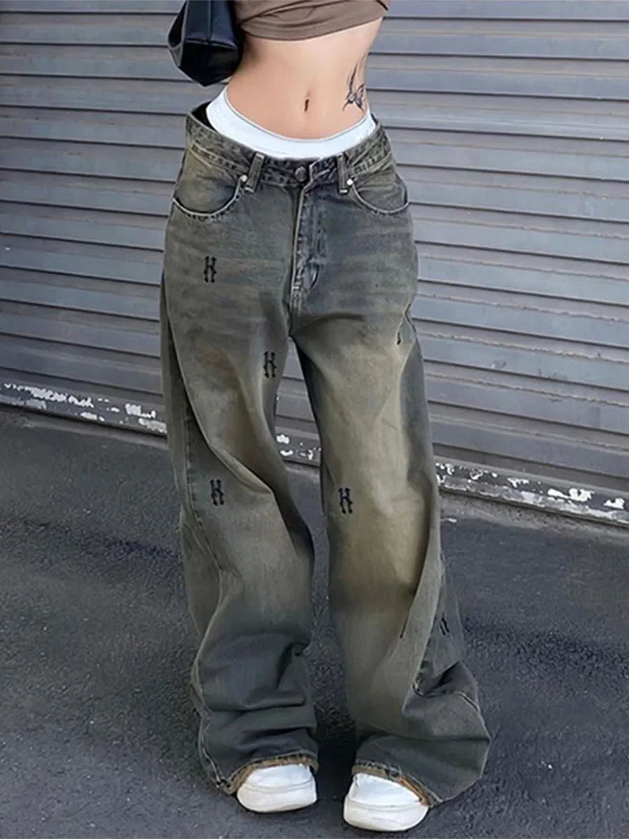 Rock the retro vibe with these baggy distressed low-rise vintage denim pants—loose, patched, and perfect for a cool mom style! -