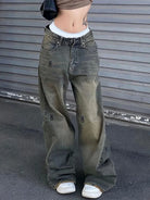 Rock the retro vibe with these baggy distressed low-rise vintage denim pants—loose, patched, and perfect for a cool mom style! -
