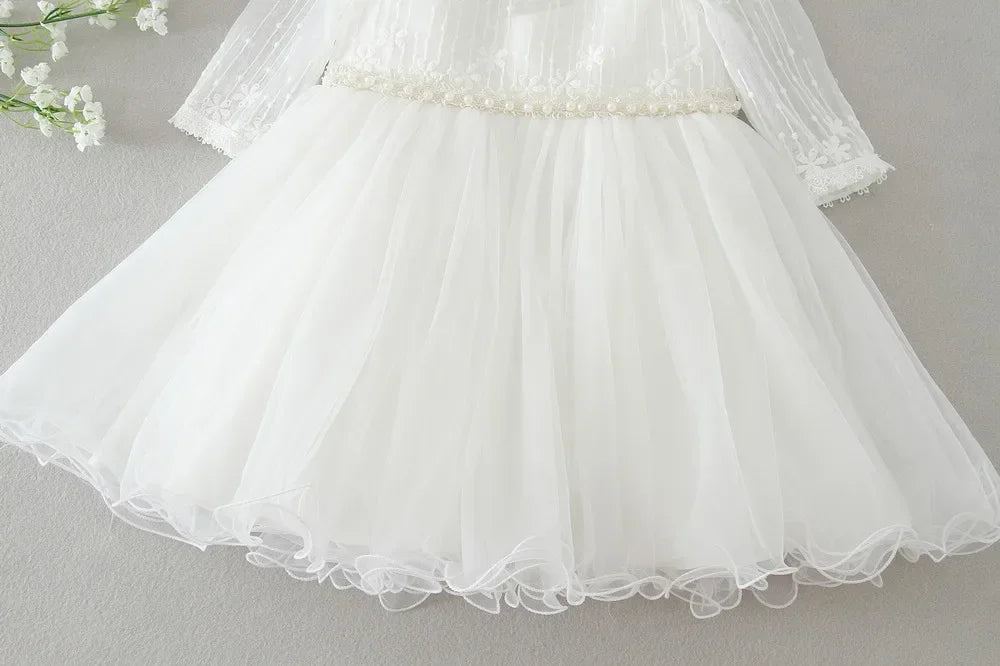 Make your baby girl shine in this elegant long-sleeve white party dress—perfect for special occasions! -