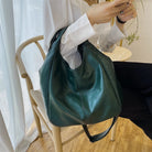 Make a stylish statement with these large shoulder bags designed for women. Crafted from soft leather, these fashionable handbags are perfect for adding a touch of sophistication to any outfit. -