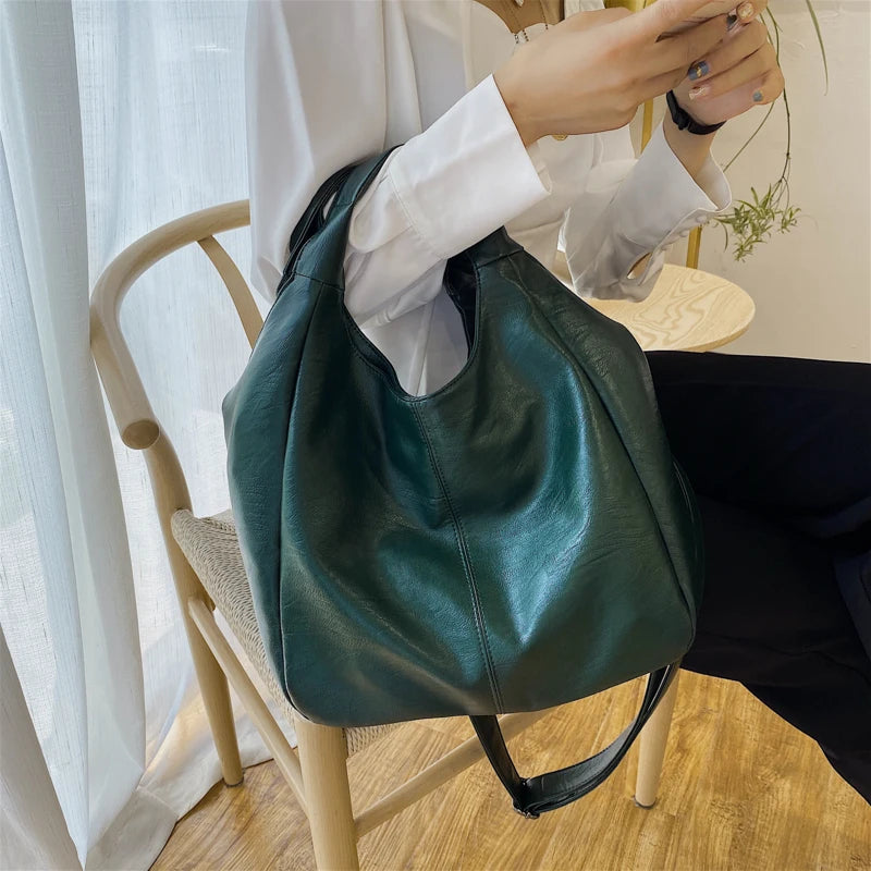 Make a stylish statement with these large shoulder bags designed for women. Crafted from soft leather, these fashionable handbags are perfect for adding a touch of sophistication to any outfit. -
