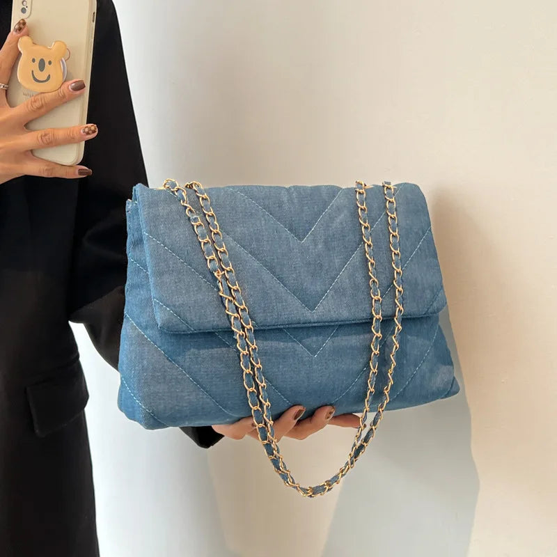 Elevate your style with this fashion luxury denim blue shoulder bag for women. Designed as a briefcase, this handbag is a chic and stylish accessory for a sophisticated and classy look. -