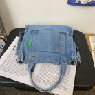 Elevate your casual look with this denim shoulder bag for women. Featuring a large design and zipper closure, this bag is perfect for shopping and everyday use, adding a touch of style to your outfit. -