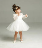 Make your baby girl shine in this elegant long-sleeve white party dress—perfect for special occasions! -