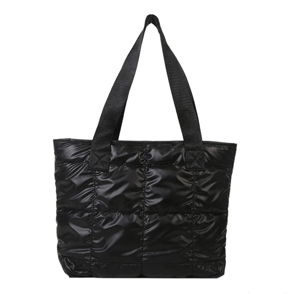 Stay stylish and organized with this fashion women's tote bag. Featuring a large capacity and cotton-padded design, this chic accessory is perfect for women who prioritize both style and functionality in their handbag. -