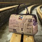 Travel in style with this waterproof handbag featuring a vintage newspaper print. Perfect for those looking for a chic and unique accessory to carry while on the go. -