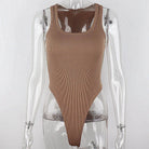 Achieve a hot and sexy look with this sleeveless knit bodysuit featuring an off-shoulder halter design. Perfect for making a stylish and alluring statement! -
