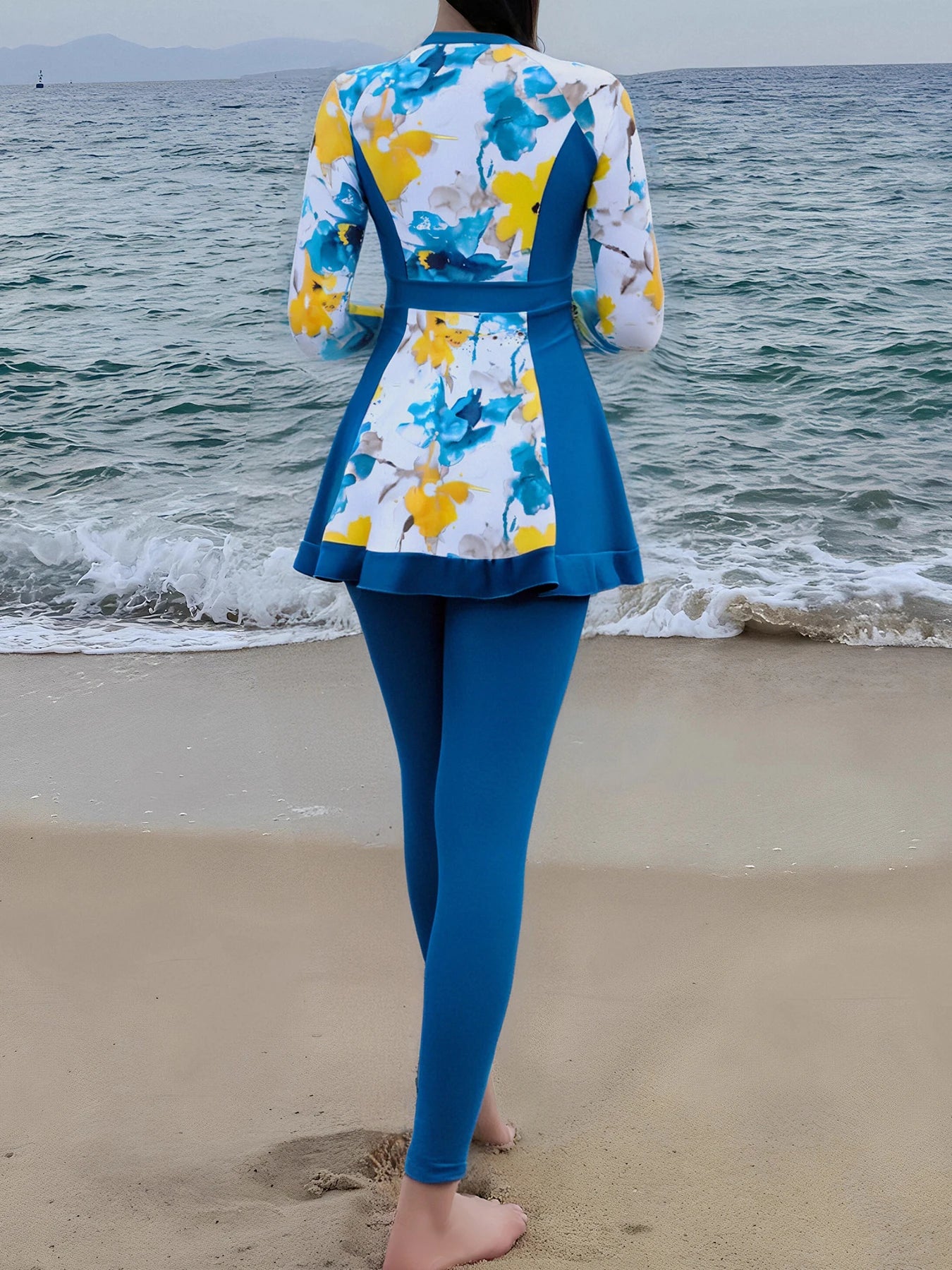 Stay covered and stylish in this long-sleeved swimsuit for women, perfect for added sun protection and a chic beach look. -