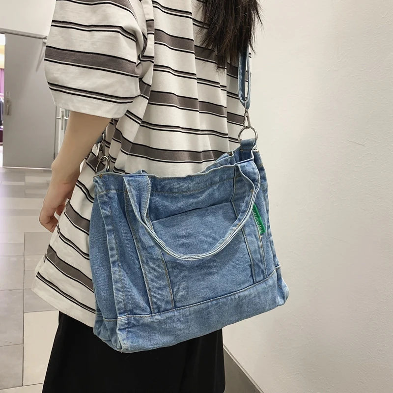 Elevate your casual look with this denim shoulder bag for women. Featuring a large design and zipper closure, this bag is perfect for shopping and everyday use, adding a touch of style to your outfit. -
