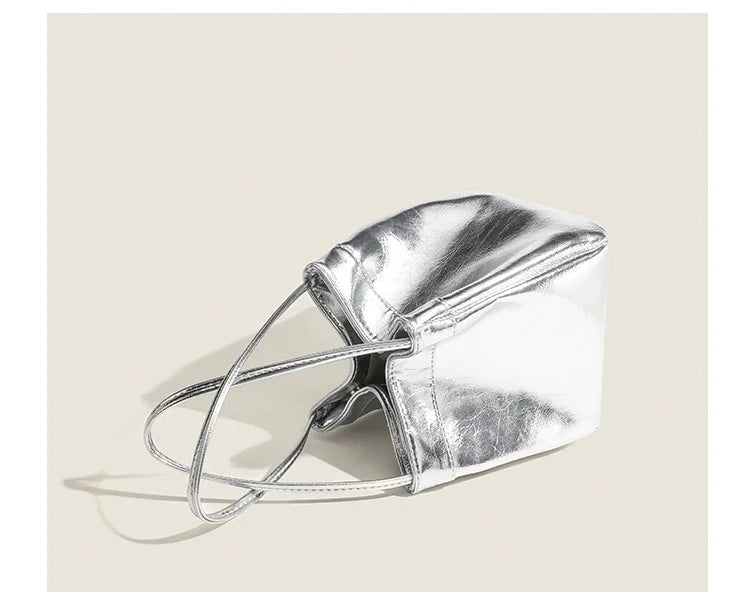 Stay on-trend with this bucket bag—a new fashion staple that offers simplicity, versatility, and a touch of classic style to elevate your wardrobe! -