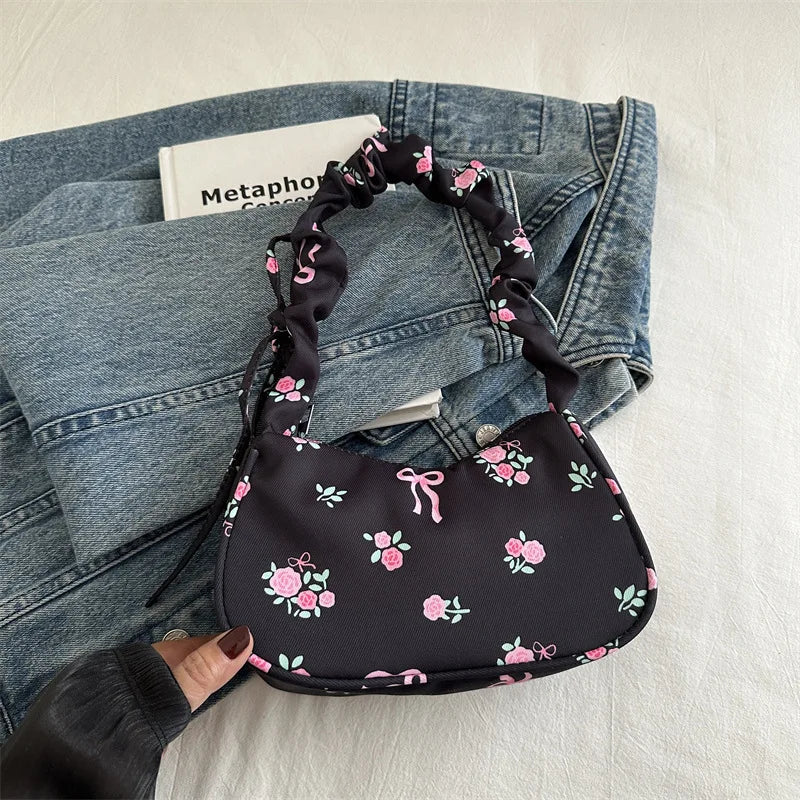 Stay stylish with these chic women's handbags made from nylon. Featuring a pleated design, these bags are perfect for the summer season, offering a trendy and functional accessory for your everyday outfits. -