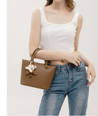 Upgrade your accessories with this new bucket bag for women. Featuring a fashionable and versatile design, this handheld bag is perfect for adding a chic and trendy touch to your look. -