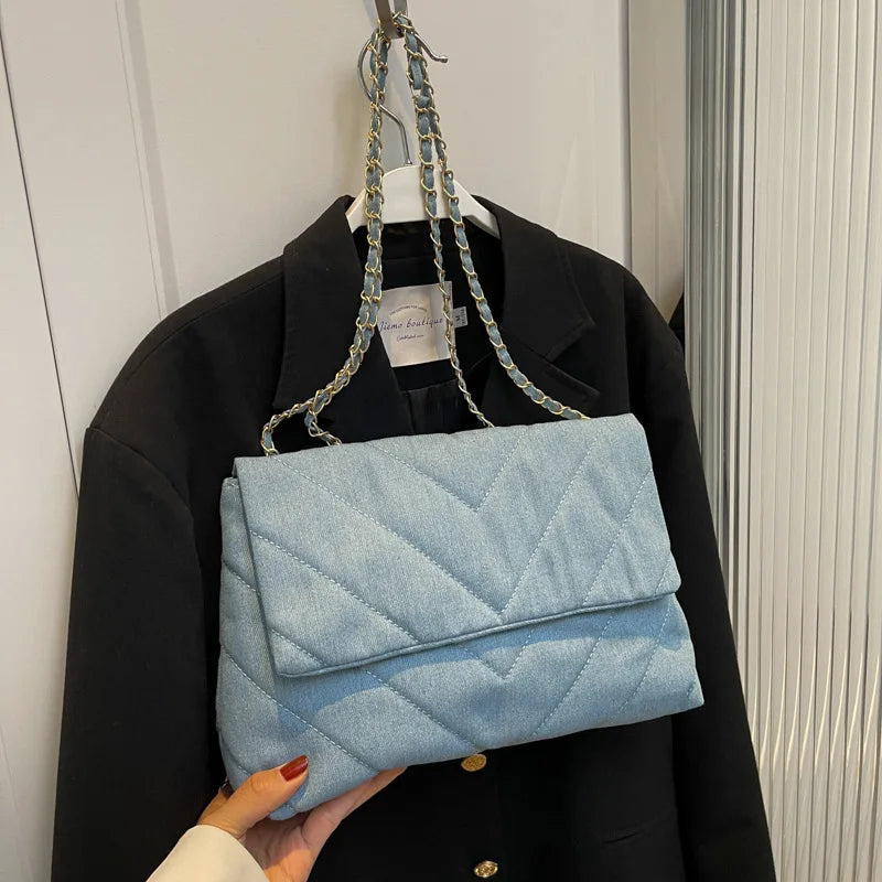 Elevate your style with this fashion luxury denim blue shoulder bag for women. Designed as a briefcase, this handbag is a chic and stylish accessory for a sophisticated and classy look. -