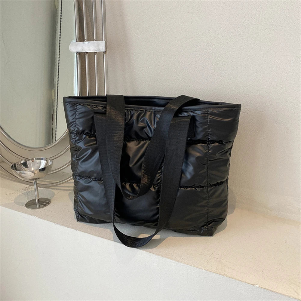 Stay stylish and organized with this fashion women's tote bag. Featuring a large capacity and cotton-padded design, this chic accessory is perfect for women who prioritize both style and functionality in their handbag. -