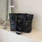 Stay stylish and organized with this fashion women's tote bag. Featuring a large capacity and cotton-padded design, this chic accessory is perfect for women who prioritize both style and functionality in their handbag. -