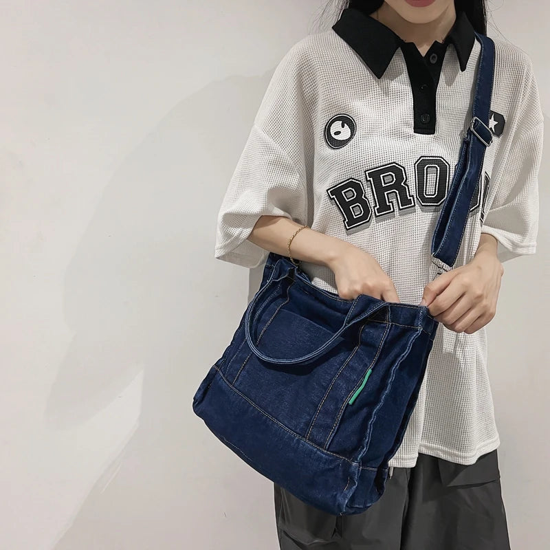 Elevate your casual look with this denim shoulder bag for women. Featuring a large design and zipper closure, this bag is perfect for shopping and everyday use, adding a touch of style to your outfit. -