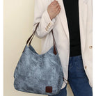 Stay organized and stylish with this large work tote bag for women. Designed with designer PU leather, this big bucket bag is perfect for carrying all your essentials in a chic and fashionable way. -