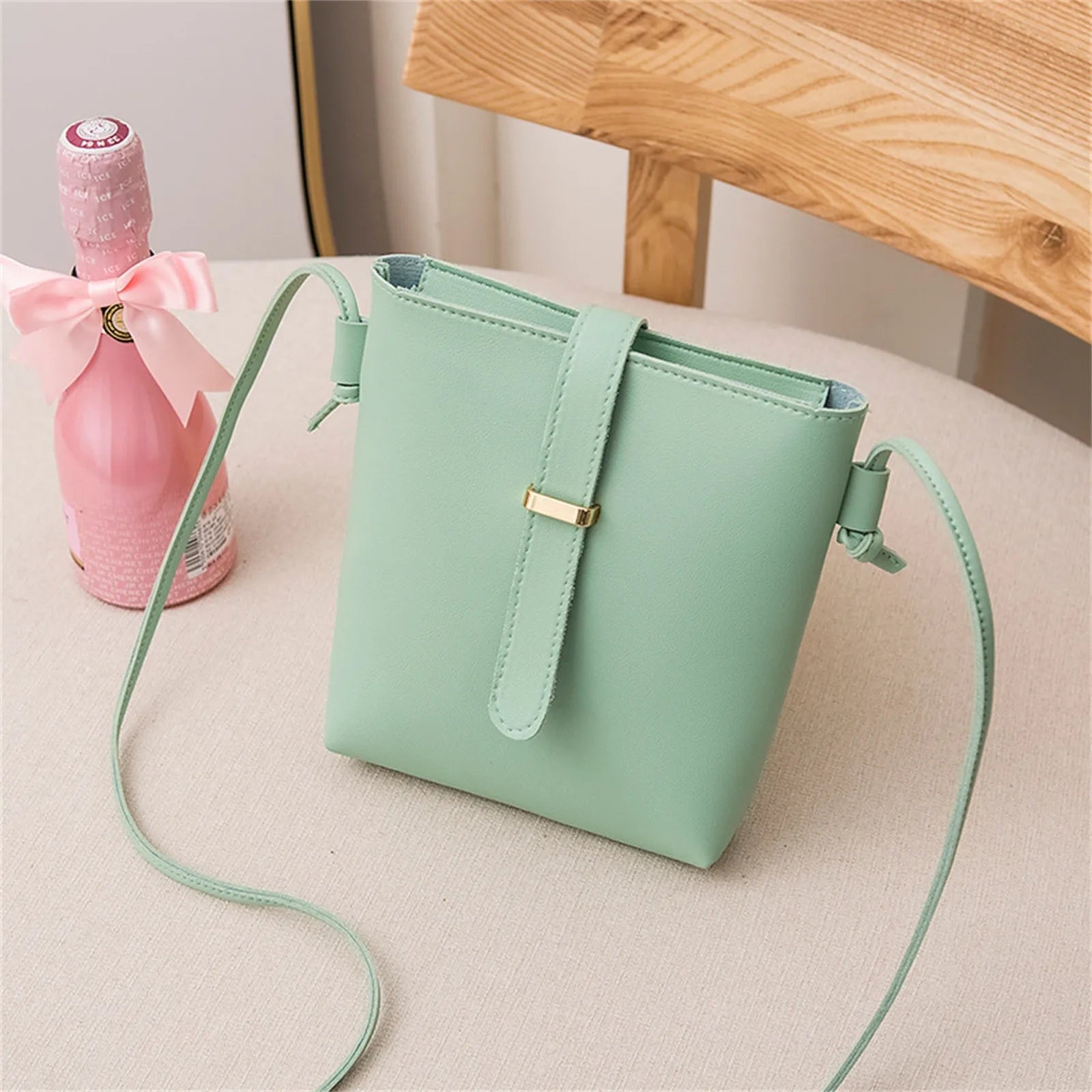 Stay on trend with this fashionable drawstring lady bag, featuring a stylish cross-border design and casual letter detail. Perfect for adding a chic and trendy touch to your outfit! -