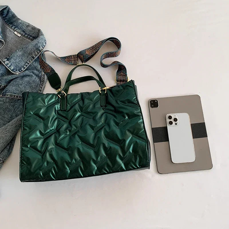 Stay on-trend with this fashion-forward large tote padded handbag featuring a designer quilted design. This stylish accessory is perfect for adding a touch of sophistication and elegance to your ensemble. -