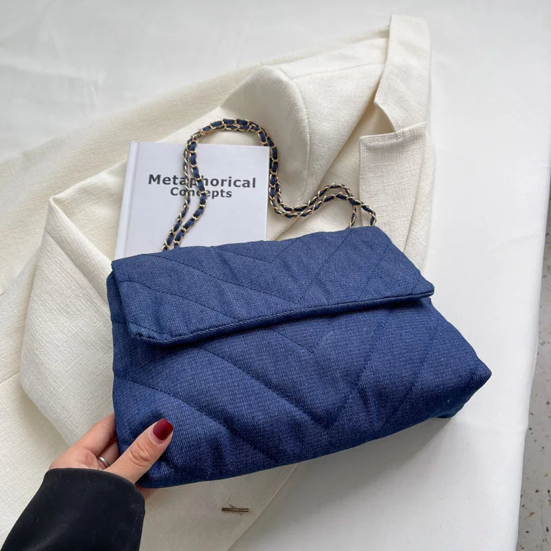 Elevate your style with this fashion luxury denim blue shoulder bag for women. Designed as a briefcase, this handbag is a chic and stylish accessory for a sophisticated and classy look. -