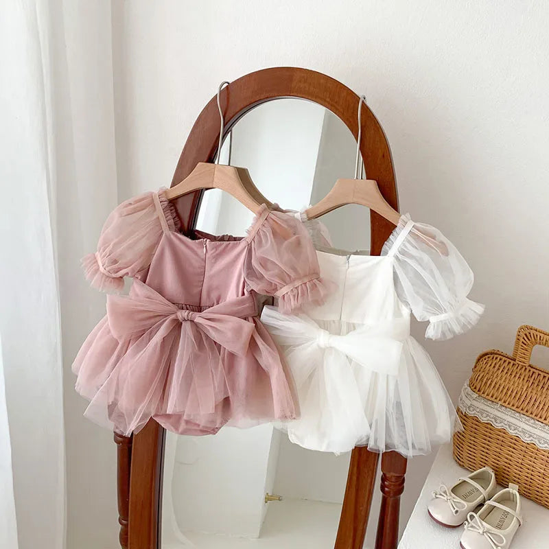 Dress your toddler in sweet style with this new baby lace dress featuring a big bowknot and short sleeves—perfect for special occasions! -