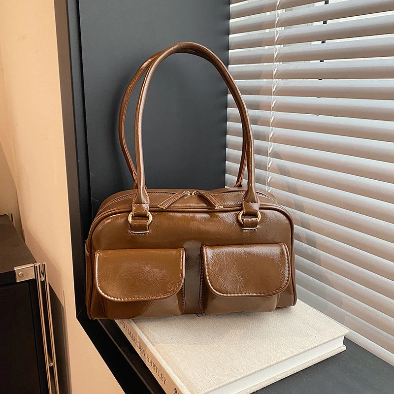 Accessorize stylishly with this black shoulder bag for women. This versatile handbag can be carried as a purse or a crossbody bag, making it a chic and practical choice for all occasions. -