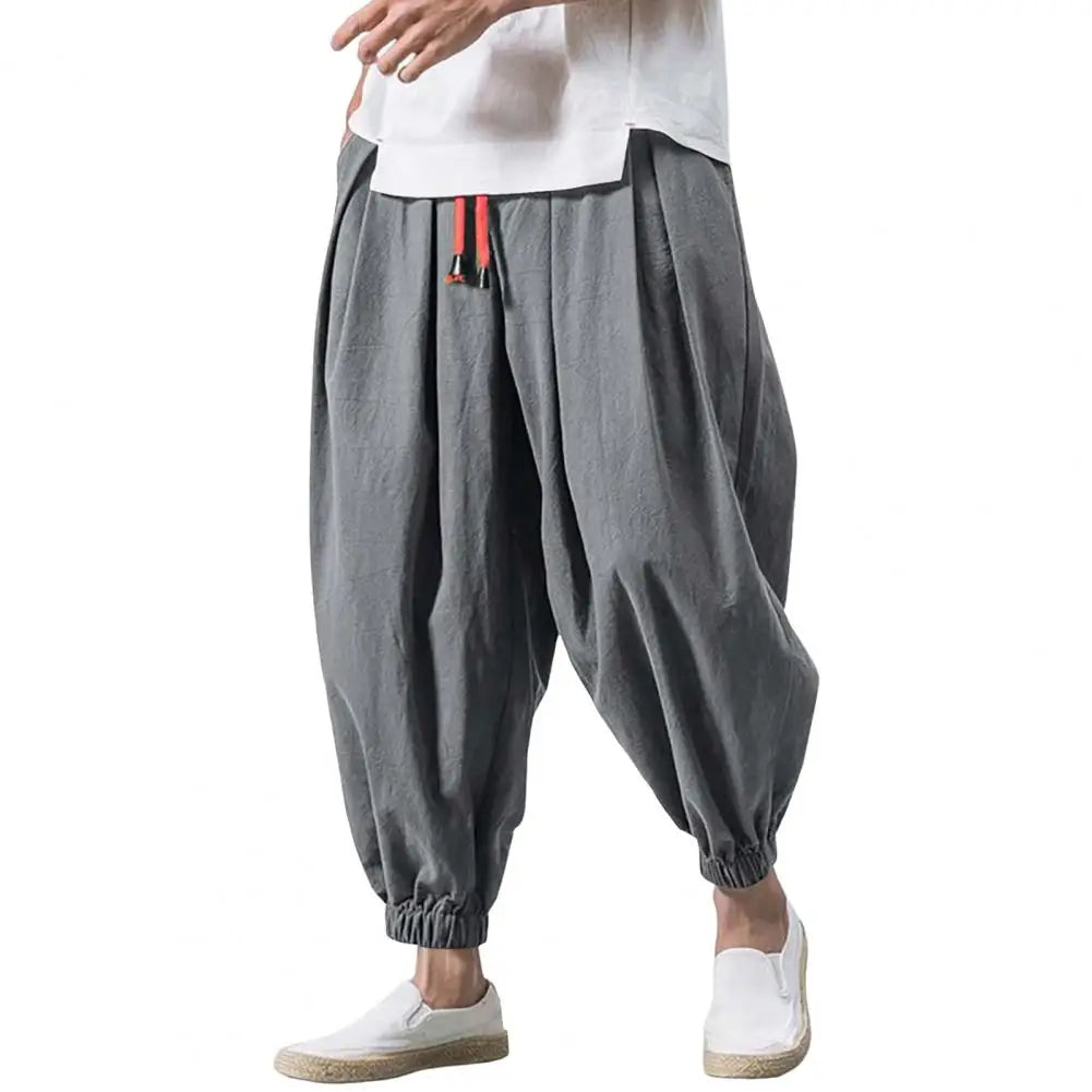 Stay comfortable and stylish in these men's baggy jogging pants featuring a drawstring waist—an ideal choice for a relaxed and casual look! -