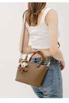 Upgrade your accessories with this new bucket bag for women. Featuring a fashionable and versatile design, this handheld bag is perfect for adding a chic and trendy touch to your look. -