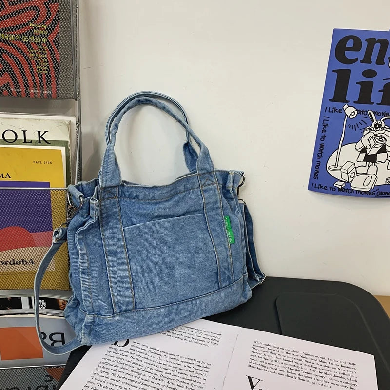 Elevate your casual look with this denim shoulder bag for women. Featuring a large design and zipper closure, this bag is perfect for shopping and everyday use, adding a touch of style to your outfit. -