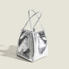 Stay on-trend with this bucket bag—a new fashion staple that offers simplicity, versatility, and a touch of classic style to elevate your wardrobe! -