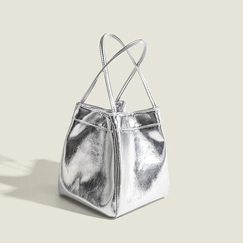 Stay on-trend with this bucket bag—a new fashion staple that offers simplicity, versatility, and a touch of classic style to elevate your wardrobe! -