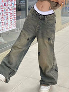Rock the retro vibe with these baggy distressed low-rise vintage denim pants—loose, patched, and perfect for a cool mom style! -