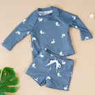 Make a splash in style with this fashionable and cute long-sleeve swimsuit for baby boys and girls—perfect for pool days and swim fun! -