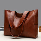 Carry all your essentials in style with this large capacity tote bag designed for women. The single shoulder handbag is crafted from soft leather, providing a chic and versatile accessory for any outfit. -