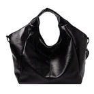 Make a stylish statement with these large shoulder bags designed for women. Crafted from soft leather, these fashionable handbags are perfect for adding a touch of sophistication to any outfit. -