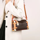 Make a statement with this luxurious and elegant box bag for women. Crafted from high-quality leather, this shoulder handbag features an elegant top-handle design, exuding sophistication and style for a classy finishing touch to your ensemble. -