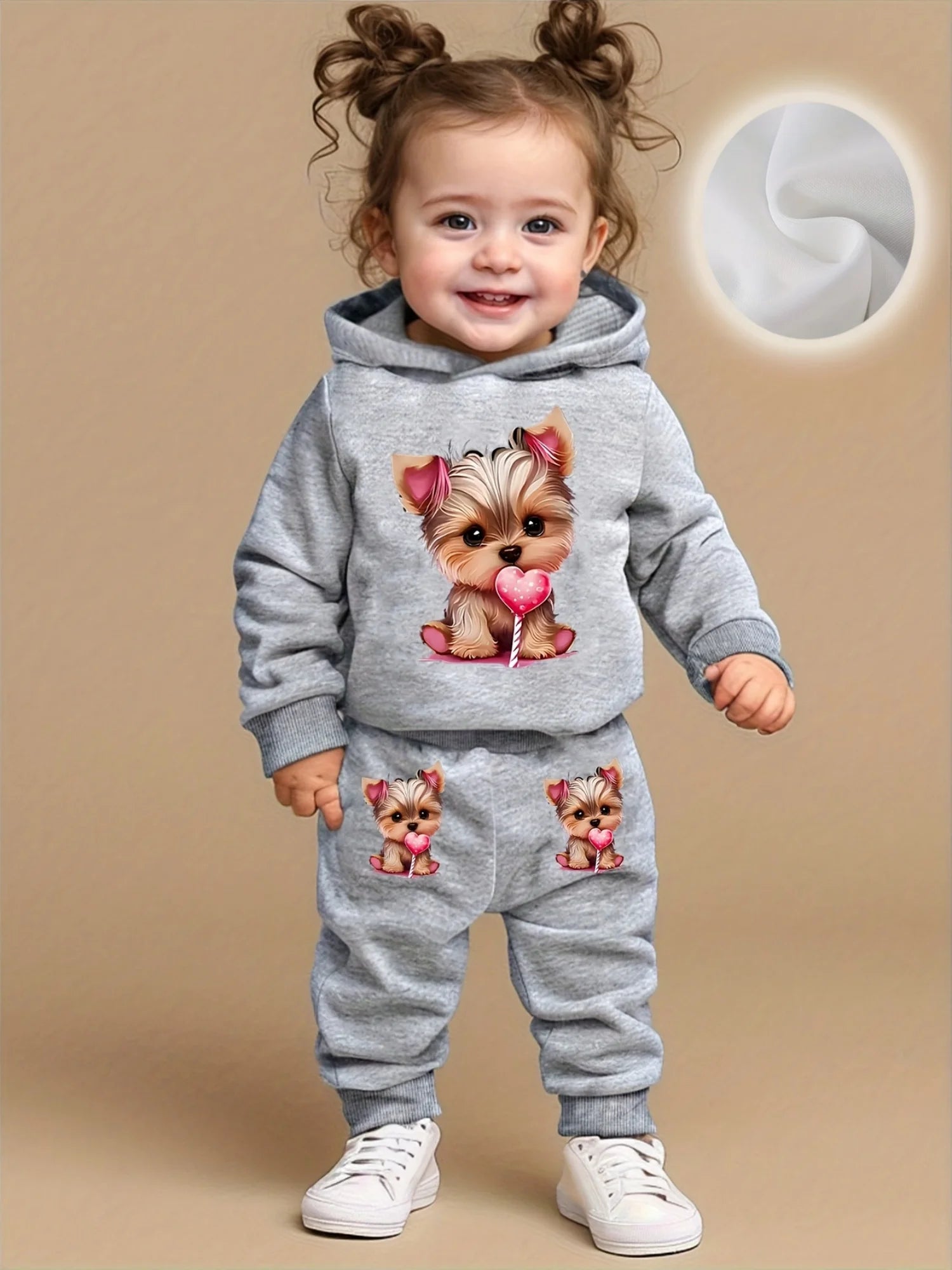 Keep your baby girl cozy and adorable with this fleece hoodie and pants set featuring a cute dog pattern print! -